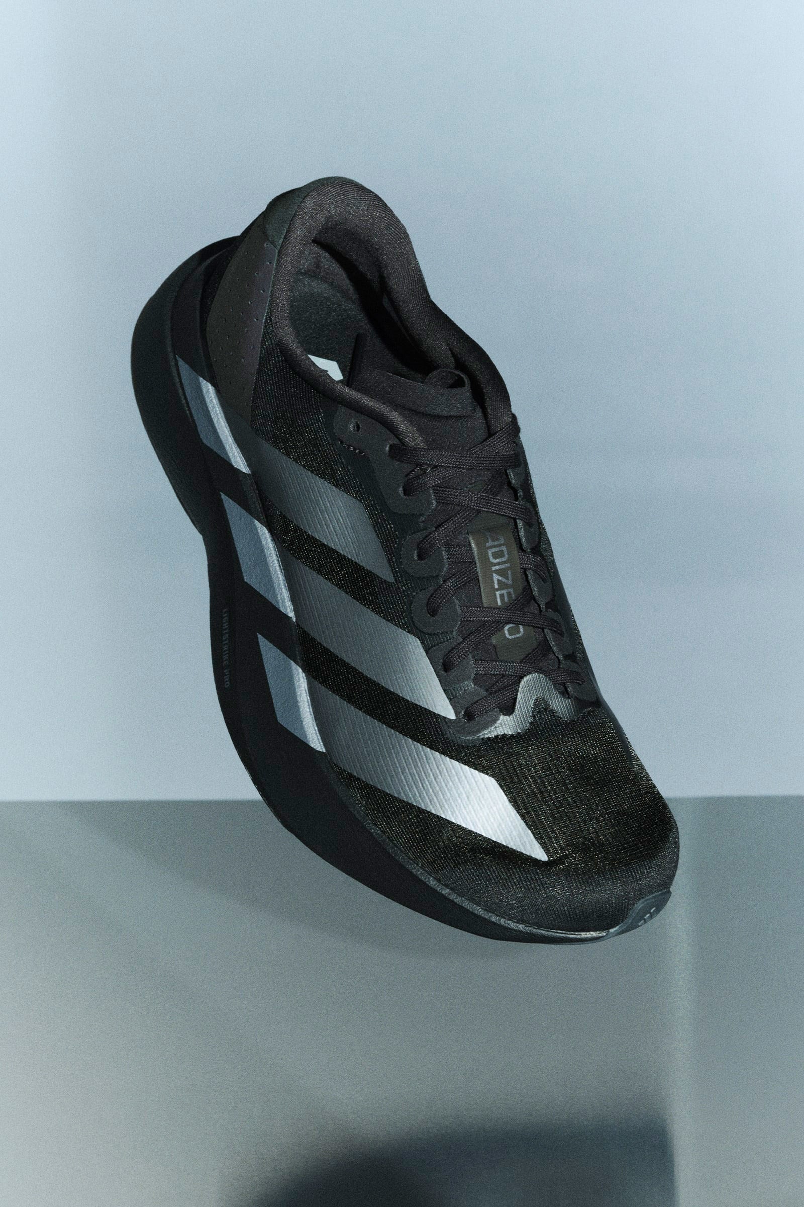 Adizero Evo SL Laufschuhe - Core Black + Iron Metallic